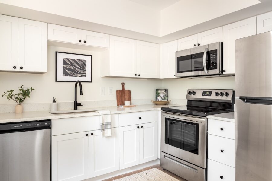 apartment kitchen with oven and washing machine